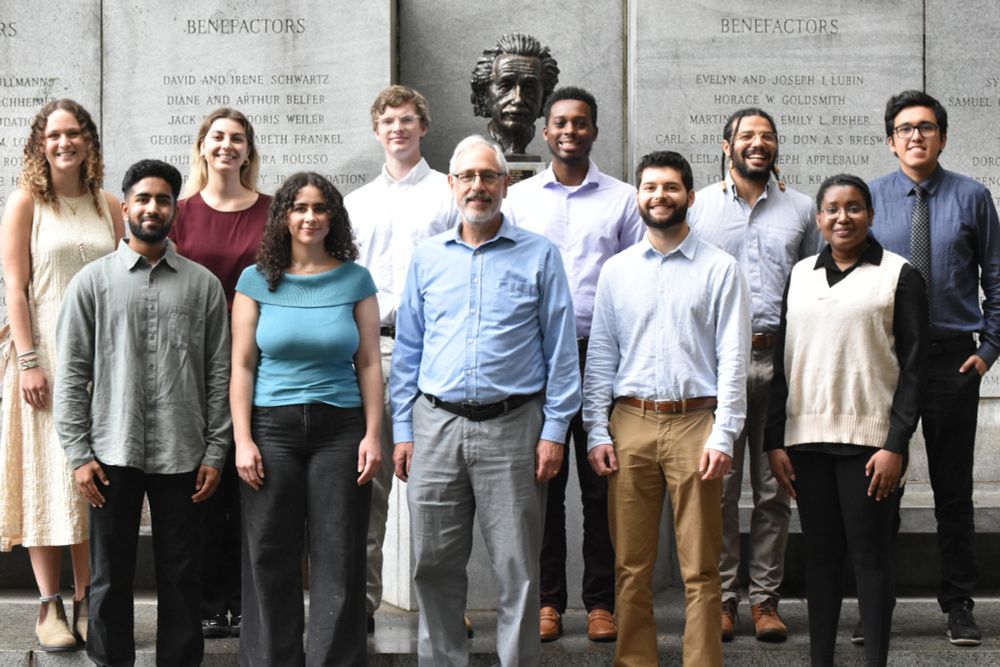 New Medical Scientist Training Program students gather in front of bust of Albert Einstein at the Forchheimer Medical Science Building to take their group photo with program leader Myles Akabas.