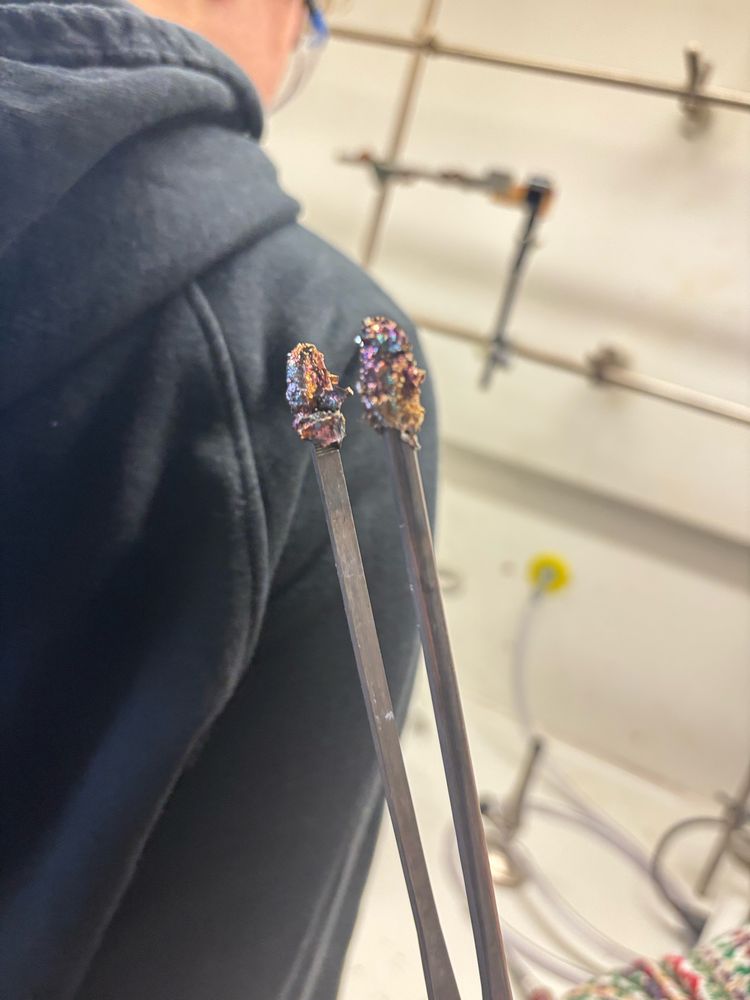 Tweezers caught some mini crystals.