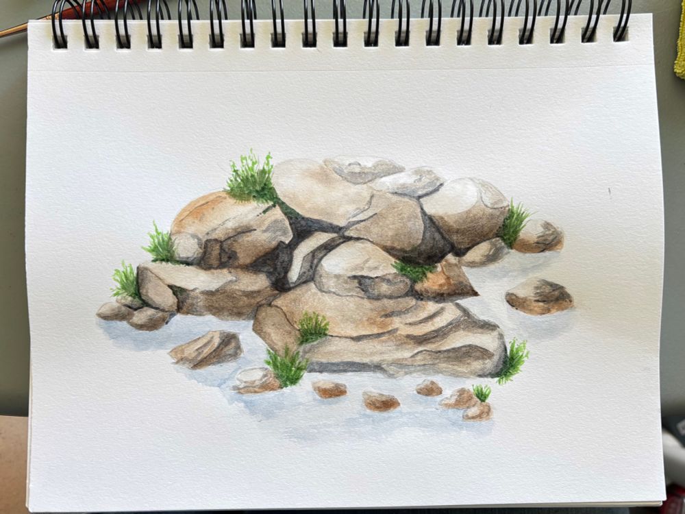 Watercolor painting of a pile of rocks