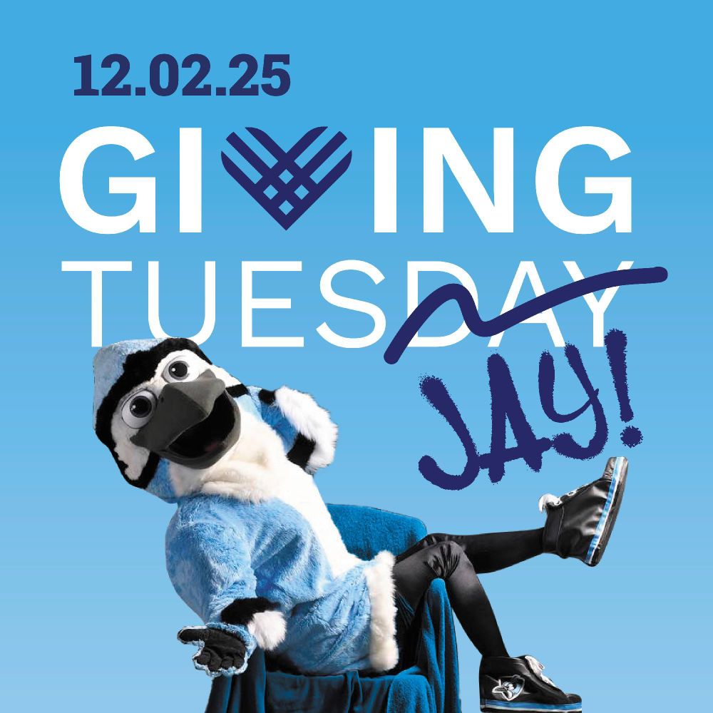 Promotional image for Giving Tuesday on December 2, 2025, featuring a person in a blue jay mascot costume celebrating joyfully.