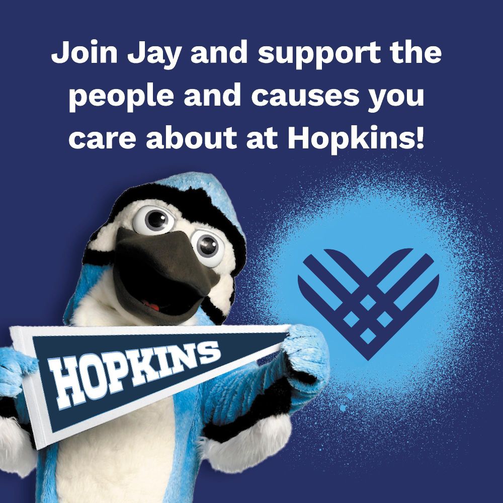 Promotional image featuring the Johns Hopkins University mascot, a blue jay, holding a 'Hopkins' sign, with a text overlay saying 'Join Jay and support the people and causes you care about at Hopkins!' and the Hopkins logo in the background.