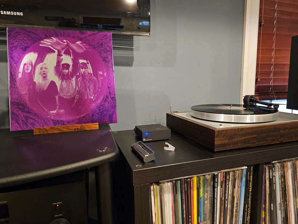 Gish by Smashing Pumpkins next to a turntable playing the record.