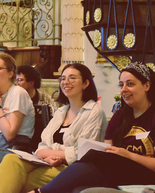 Students athe SCM National Gathering smiling and looking at something in the distance.