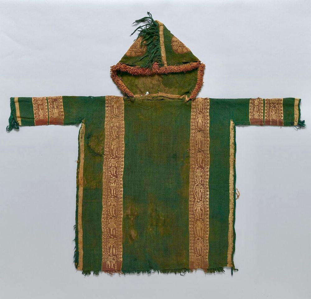 A photo of a green hoodie from Egypt, a tunic with a hood attached. 