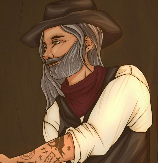 Ed angled towards the side, smiling, with his hand outstretched. He’s wearing a cowboy hat, leather vest, white shirt and burgundy bandana. 