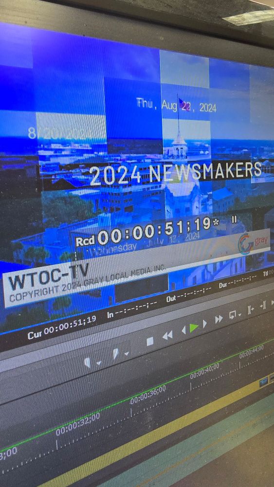 A computer screen with 2024 News makers in text over a blue graphic. 