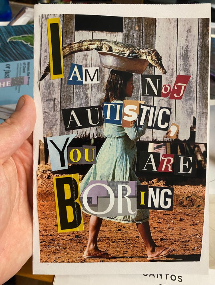 A young woman walks on a dirt road as she balances a crocodile on her head. Superimposed on the image are letters cut from several different magazines. They spell out the message “I am not autistic, you are boring.” 