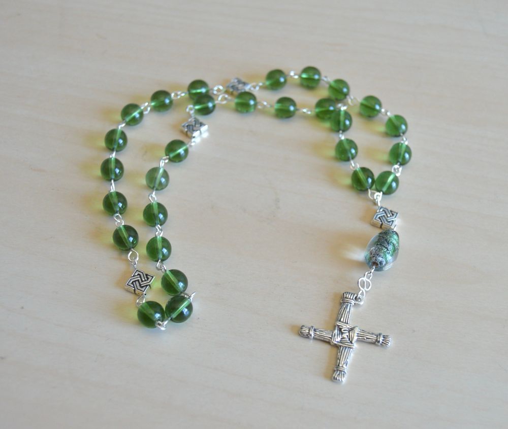 Episcopal prayer beads with light green glass and Celtic silver beads and a st bright cross. 