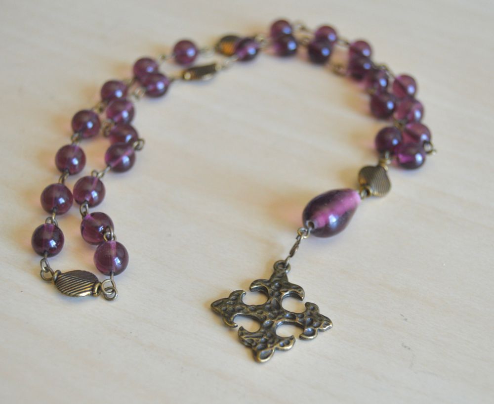 Episcopal prayer beads in purple glass with antique brass flour de lis cross focal 