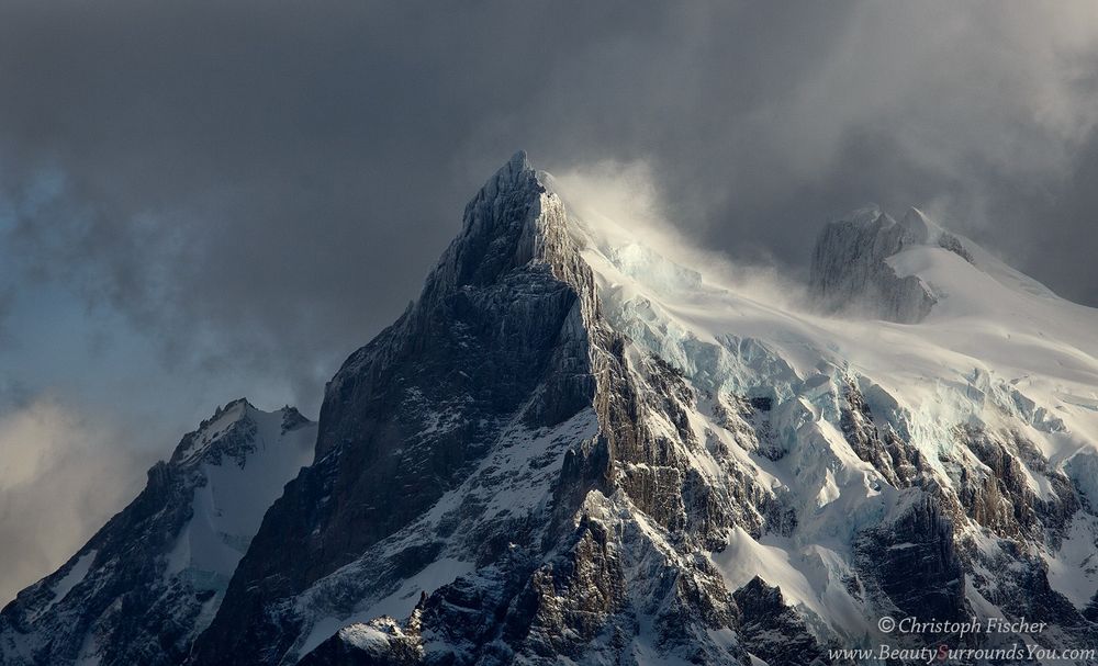 Fierce winds drive off snow and ice from the peaks of Paine Grande in Patagonia's Torres del Paine National Park. There is a whole world of drama and grandeur to be found far above in the peaks of mountains, and especially so for Patagonia!