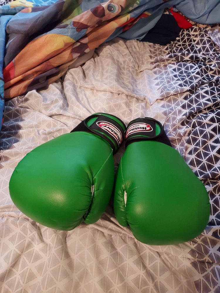Green boxing gloves that I've got gifted for my birthday