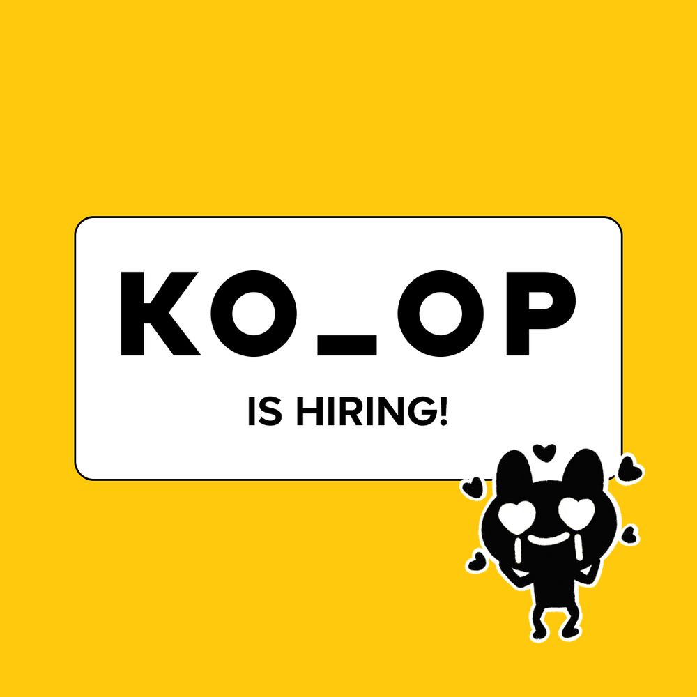 Text inside of a white rectangle that reads: KO_OP is hiring! Our studio mascot, Ini—a dark genderless humanoid with big white eyes—is in the bottom right corner with heart eyes and little hearts over their head. The background is yellow.