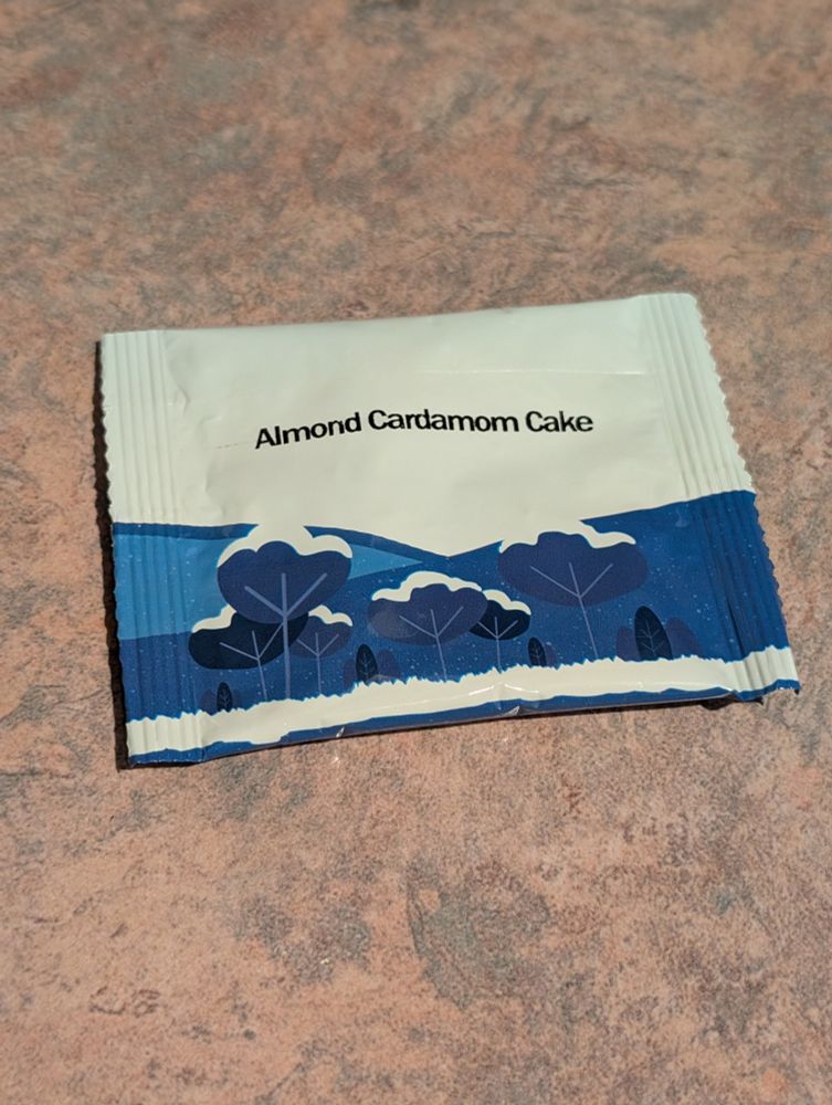 A blue and white tea packet with pictures of trees.