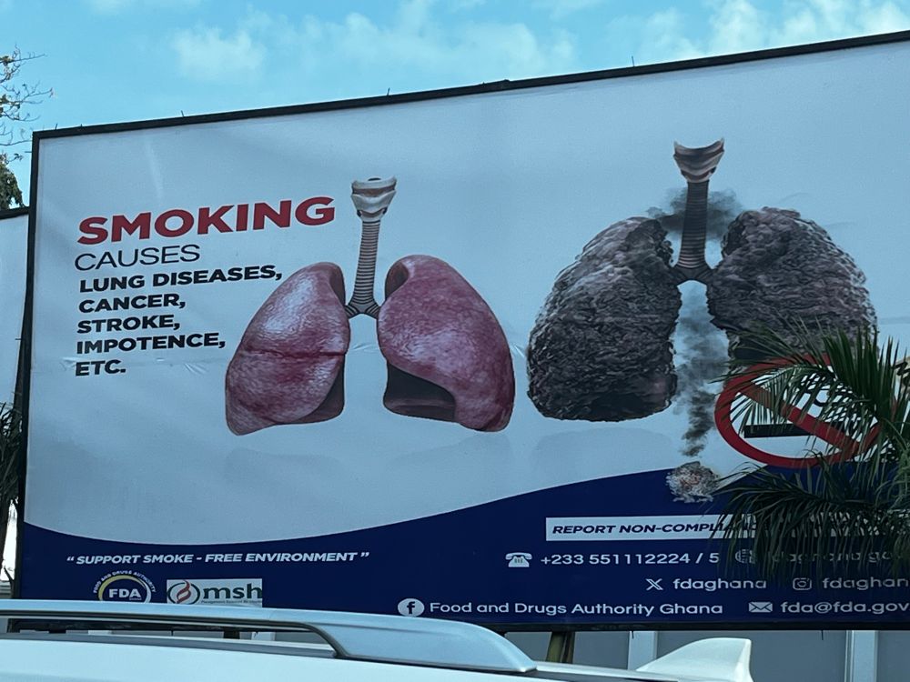 A billboard with a public health message about the dangers of smoking. Image is a diseased lung and a list of the conditions smoking can cause, ending with “etc”