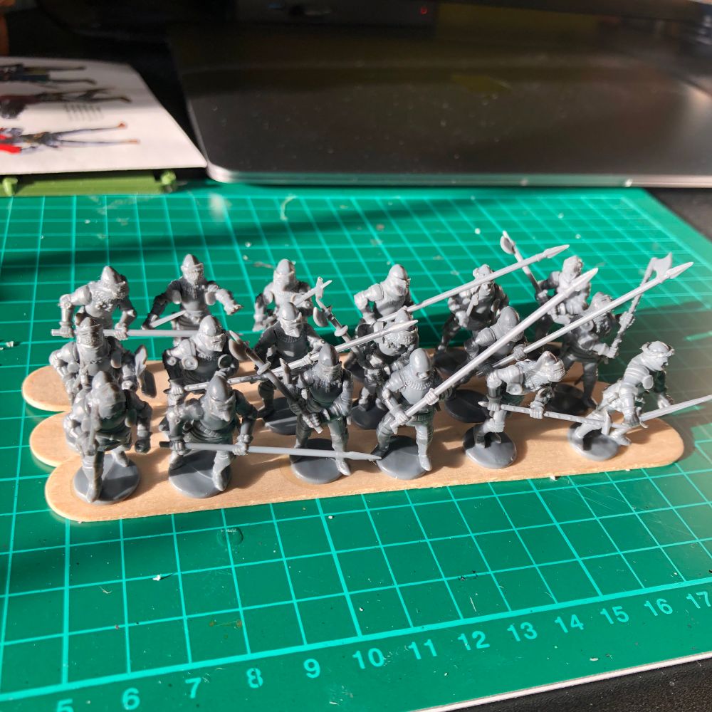 Perry plastic medieval French knights from the Hundred Years’ War. All bare plastic at the moment just after assembly, awaiting priming. They are glued to sticks in sixes, to match the intended final basing. 