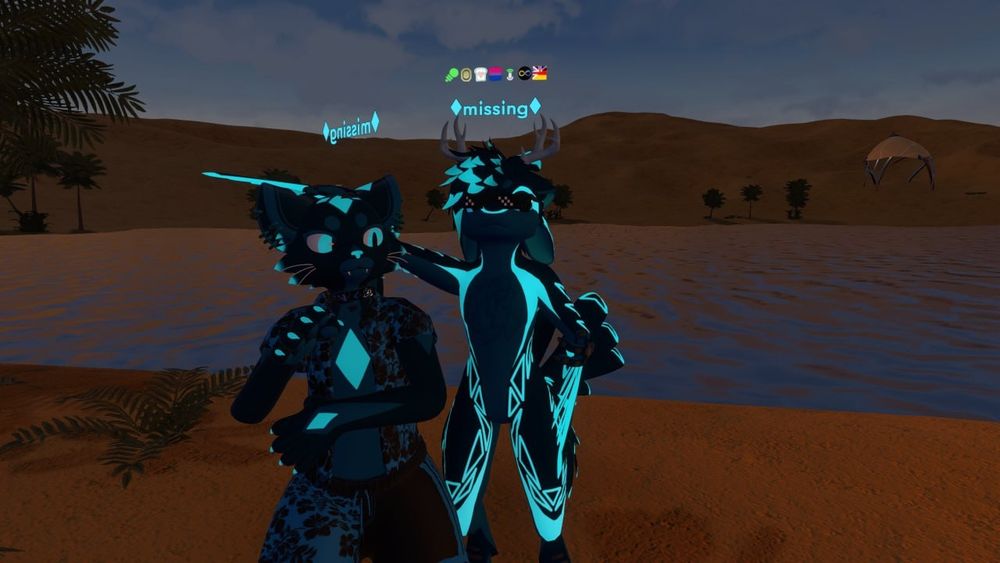 Two VR avatars. One big cat and one Avali