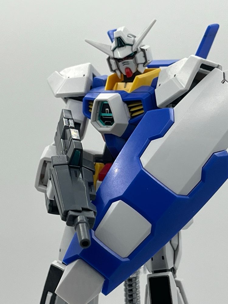 AGE-1 with her DODS Rifle and shield pointed down crossing over each other