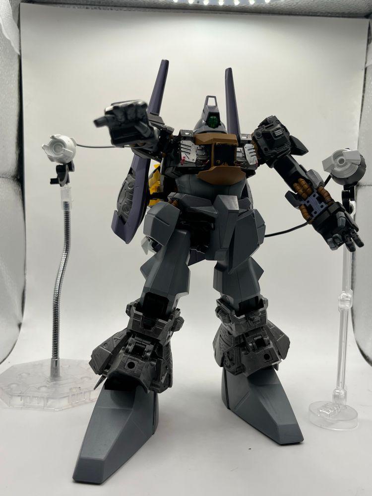 2 pieces of the Aun Armor off the backpack acting as wired particle cannons