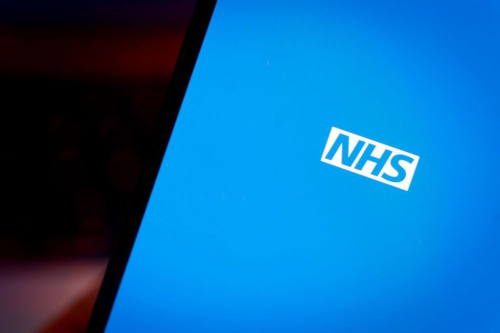 Blue screen with NHS logo
