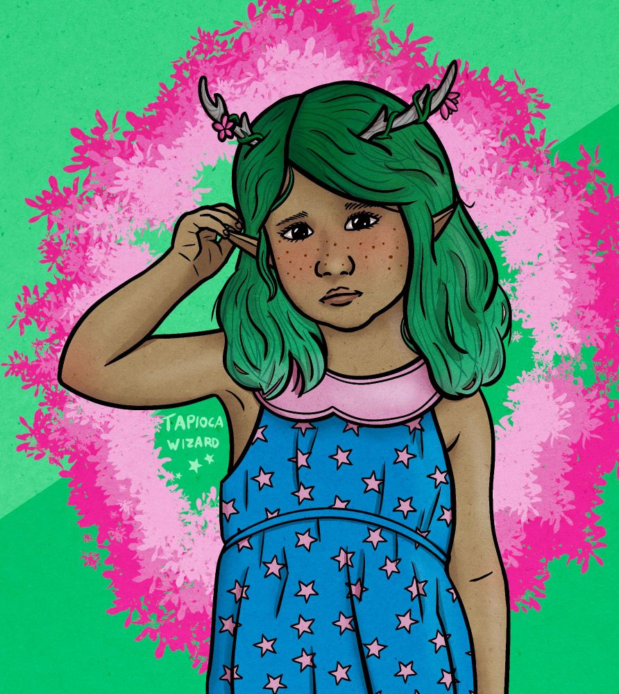 A digital illustration of a toddler girl with green hair and small antlers on her head. She has medium-brown skin and freckles, and her ears are pointed in an elven shape. She wears a blue dress with pink stars and a pink collar. Her antlers have small vines wrapped around them, seemingly growing out of her head as well, and there are also small pink flowers. She is playing with one ear as a shy fidget. 