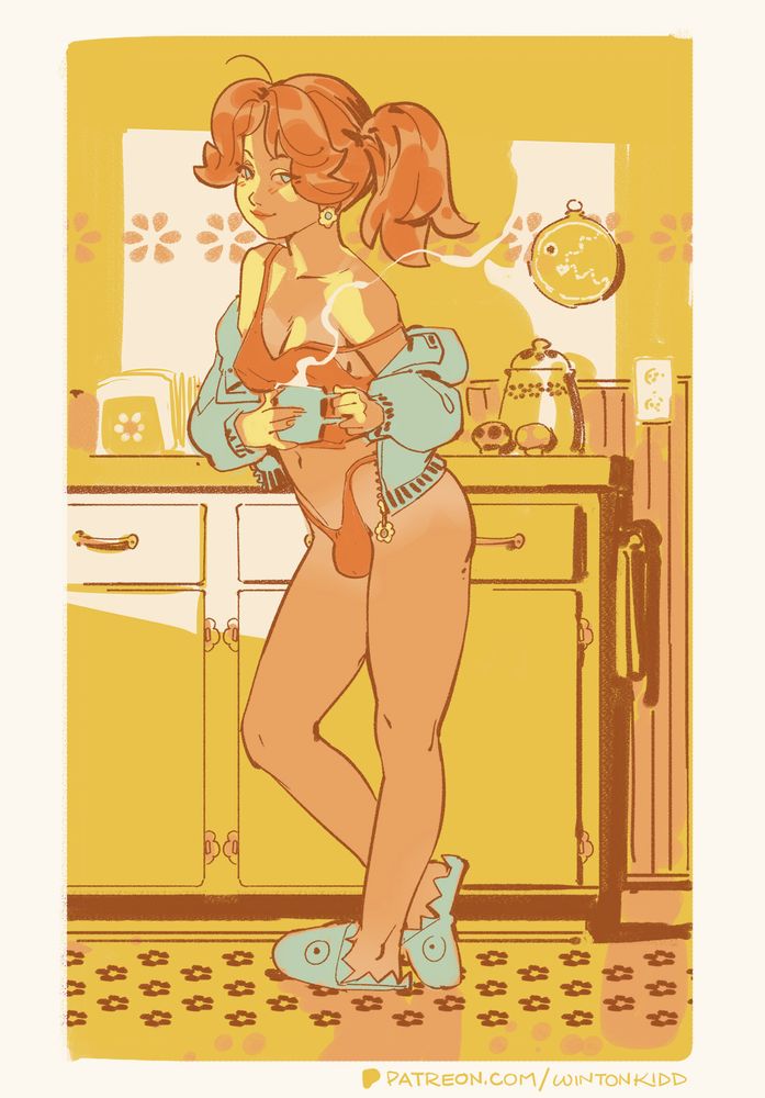 Daisy holds a mug of coffee in a kitchen as light streams in through the window.