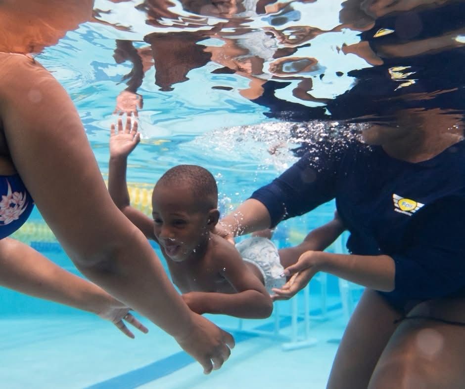A photo of a little boy swimming 