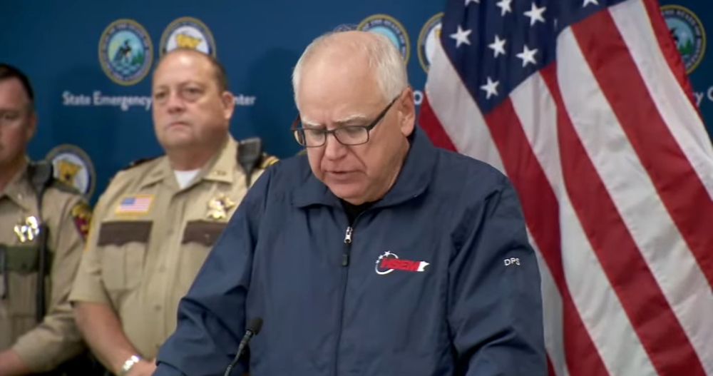 Tim Walz speaks in a blue jacket 