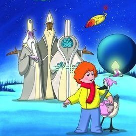 A colorful movie poster for "A Cosmic Christmas" showing a snowy night landscape with a starry sky and a large blue planet in the background. In the foreground, a red-haired boy in a yellow jacket and blue pants stands smiling, holding a small pink alien creature with a Santa hat. Behind them are three tall, glowing, cone-headed alien figures in robes (purple, white, and teal). A yellow spaceship with red lights flies overhead. 