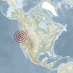 This photo is a map of North America with a specific location marked by a red target symbol. The target symbol is located in the western United States, specifically in the region that includes parts of Washington, Oregon, Idaho, and possibly parts of northern California and Nevada. This area is in the Pacific Northwest region of the United States. The map provides a broad geographical context, showing the continent of North America, including parts of Canada and Mexico, with a focus on the highlighted region.