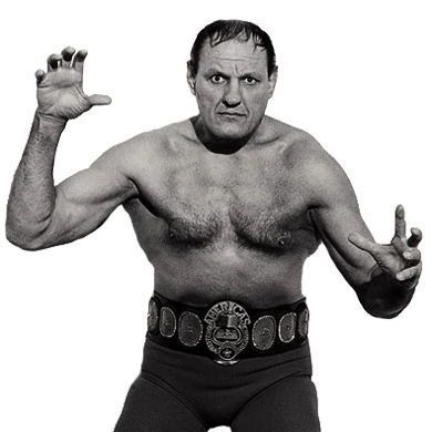 A muscular man in a black-and-white photo, posing with arms raised and hands clawed, wearing a championship belt labeled "Americas" around his waist, with no shirt and dark pants.
