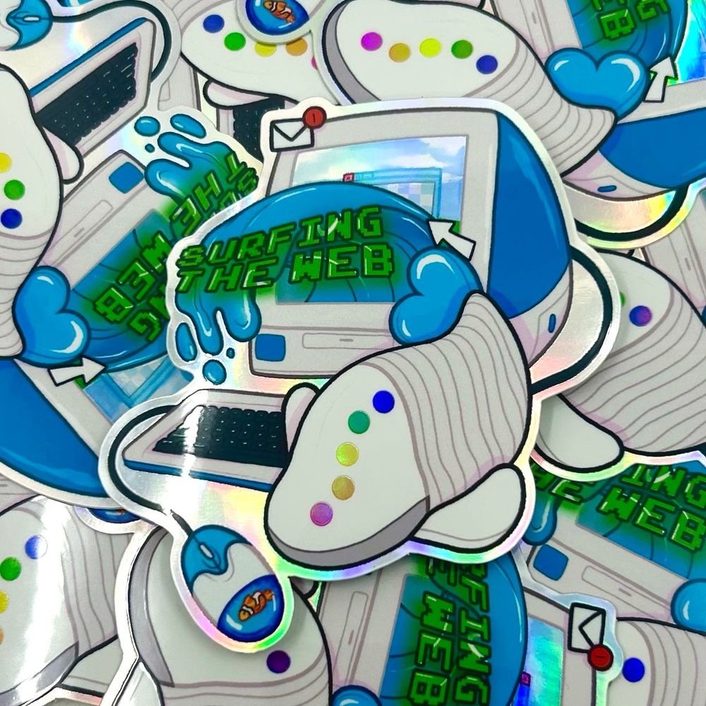 A pile of stickers, the top one reading “Surfing the web” with an iFish coming out of an old computer next to a floating fish mouse