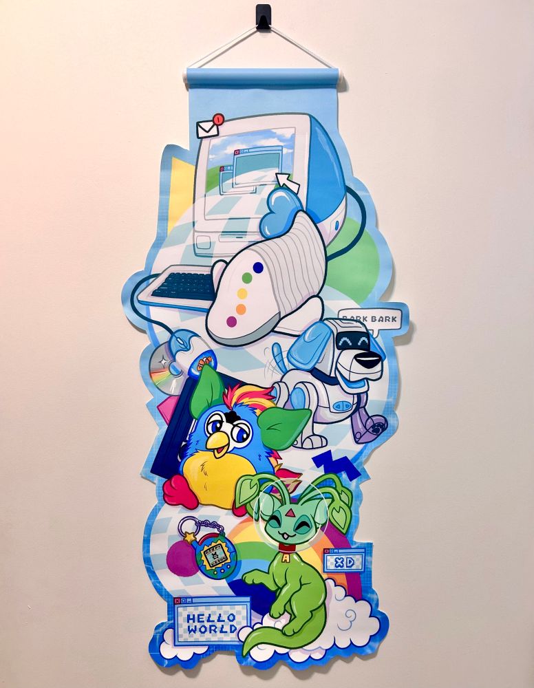 A fabric banner with an old computer at the top, spilling out from the screen are an iFish, a Poochi, a Furby, and an alien Aisha surrounded by other early 2000s memorabilia