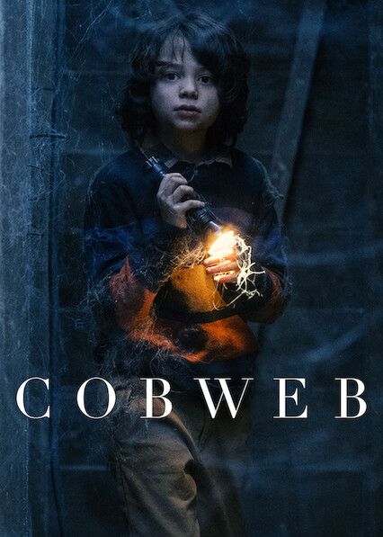 cobweb movie poster

little boy holding a lit flashlight