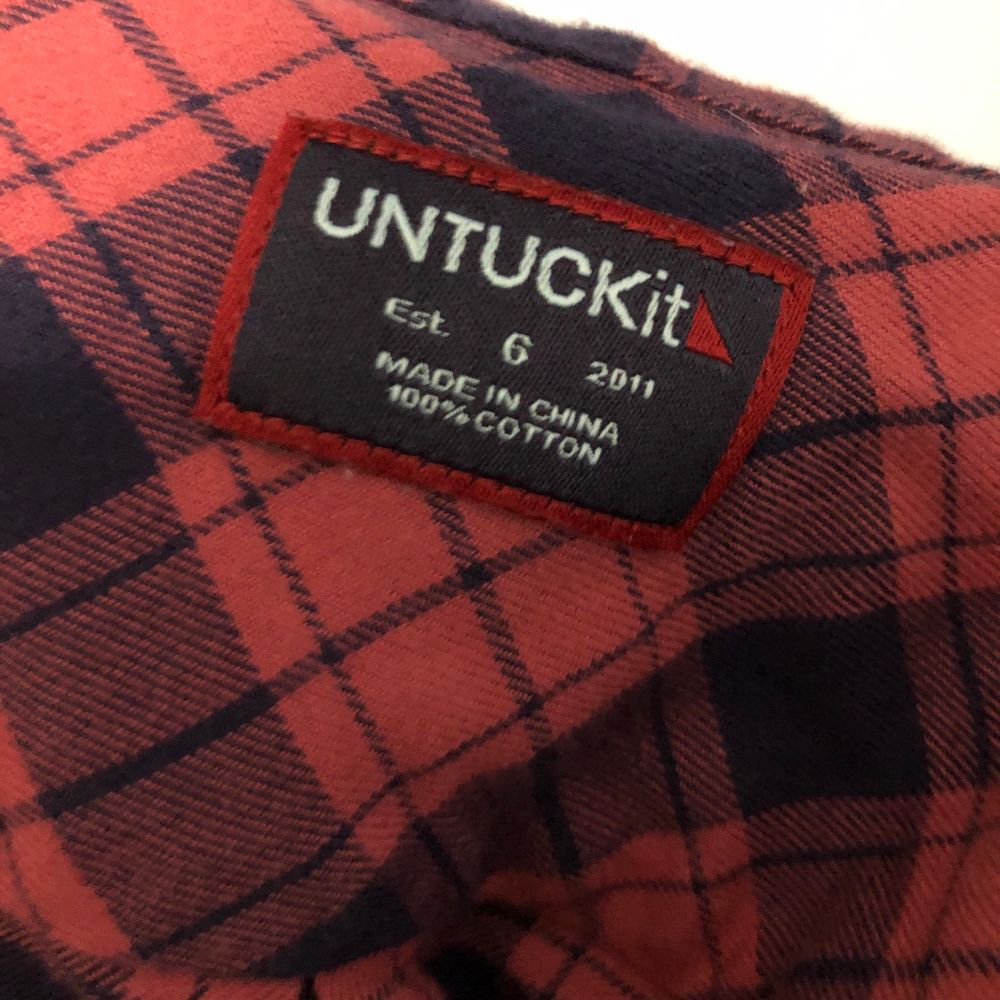 shirt tag, brand is apparently UNTUCKit.