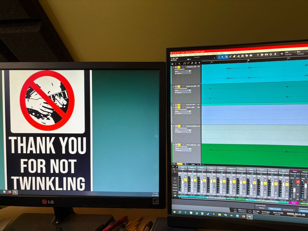 side by side monitors. one is a desktop wallpaper with the middle man records “thank you for not twinkling” poster (someone playing a tapping part on guitar, crossed off with an anti-sign circle thing). the other is a DAW showing a song being actively worked on.

implication is that the song on the right is twinkle, despite the protesting of the monitor on the left.