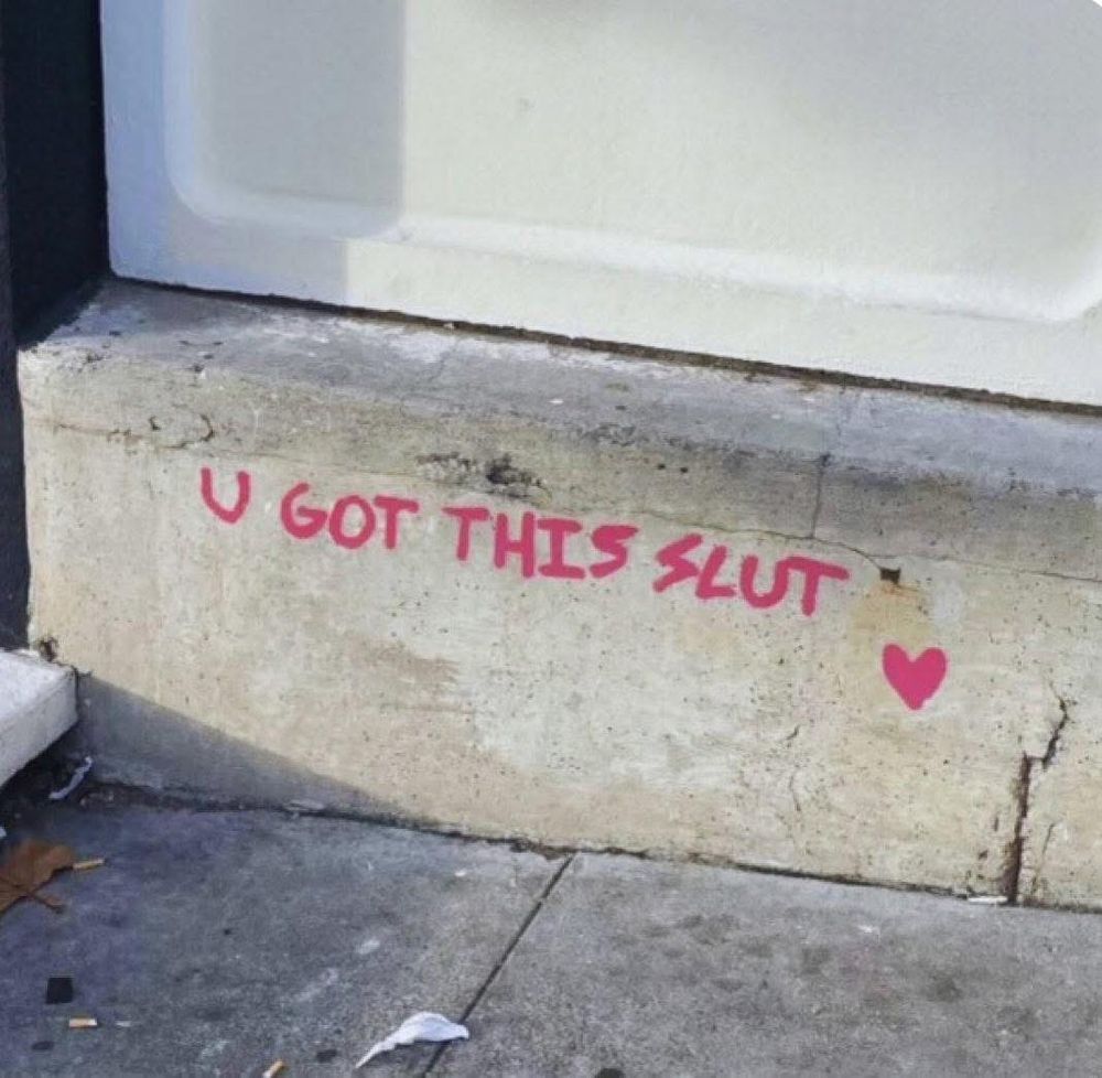 u got this slut with a heart written in pink on concrete 