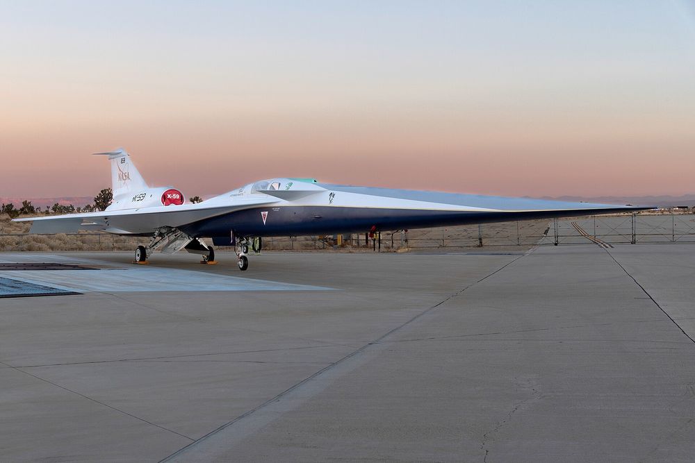 NASA X-59 on a runway. it has a verrrrrrry long nose and is designed to achieve supersonic speeds quietly 