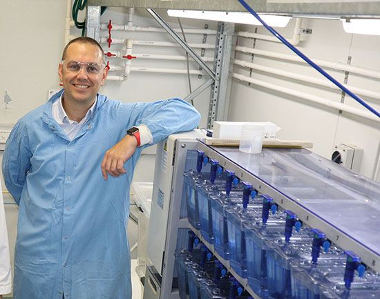 Dr Tom Cresswell in the aquatic labs at ANSTO where plastics research is done