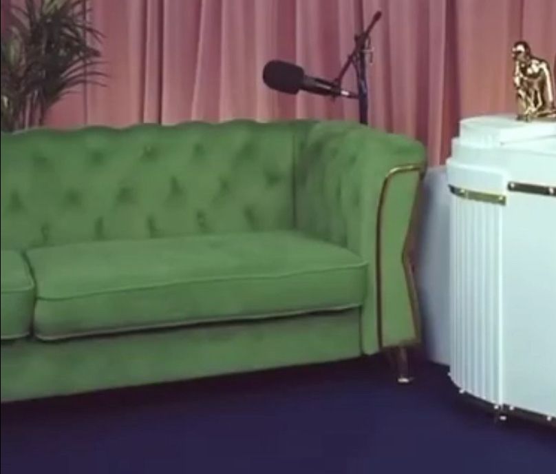 Green couch from very delta podcast