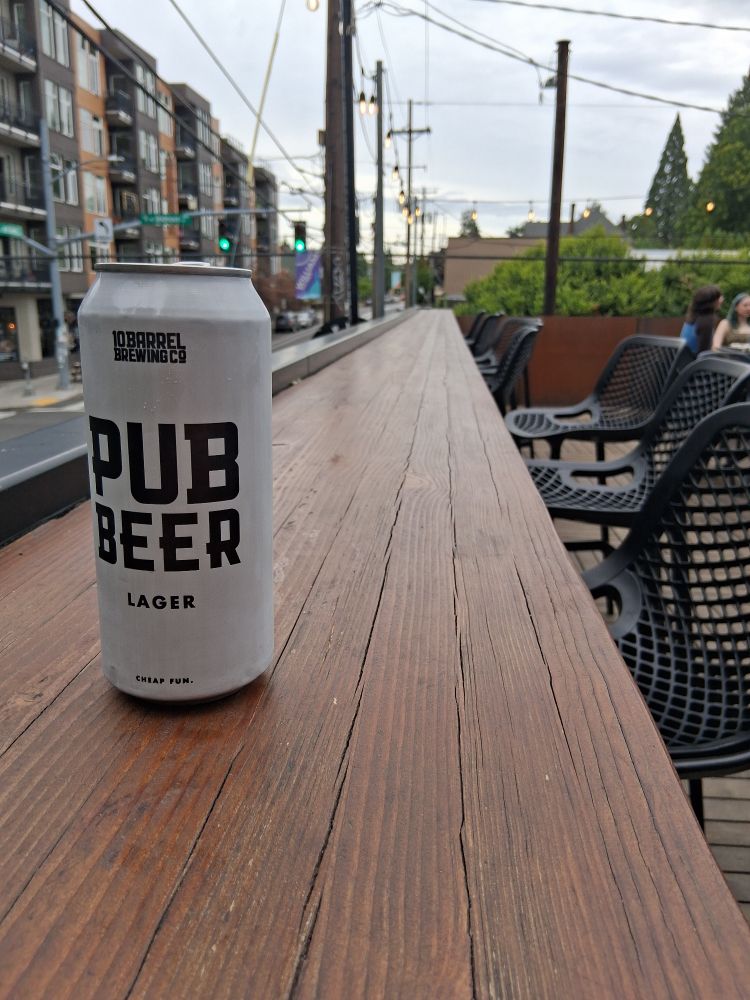 I'm enjoying a beer on a posh rooftop bar