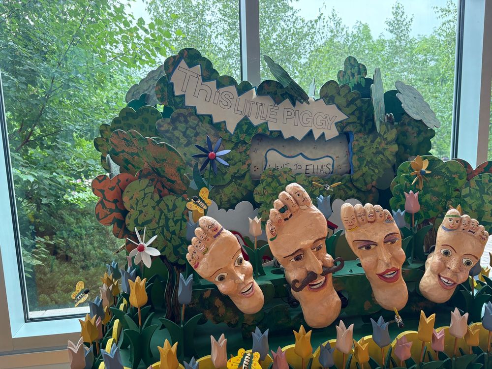 A quirky animated diorama of feet in the theme of “This Little Piggy”
