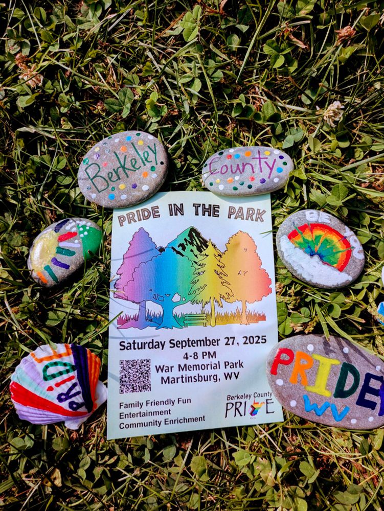 Colorful painted rocks with the words Berkeley County Pride and rainbows surround a flyer for an upcoming Pride in the Park event referenced in the caption.