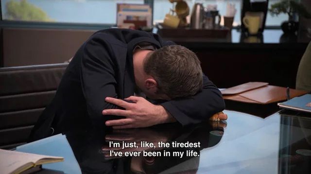 Tim Robinson from I Think You Should Leave with his head down on a table and a caption that says “I’m just, like, the tiredest I’ve ever been in my life.”
