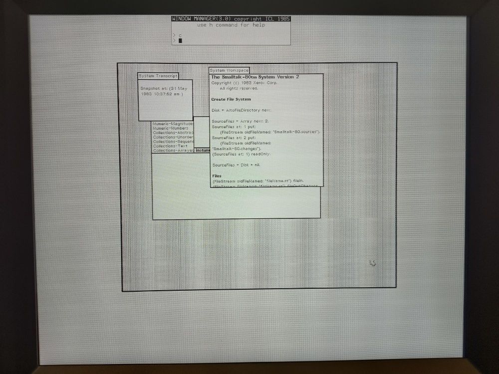 A monochrome graphical display from an old computer workstation. In a large window at the centre of the display, a Smalltalk-80 session can be seen, with a browser window partially occluded by a System Transcript and a System Workspace window.
