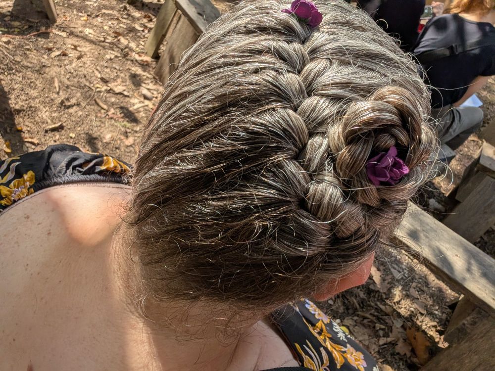 My grey hair braided with purple butterfly clips