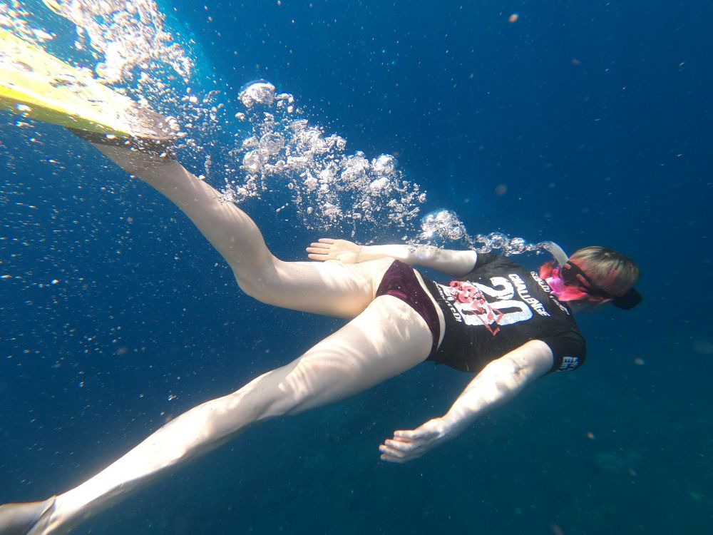 A woman snorkelling underwater 