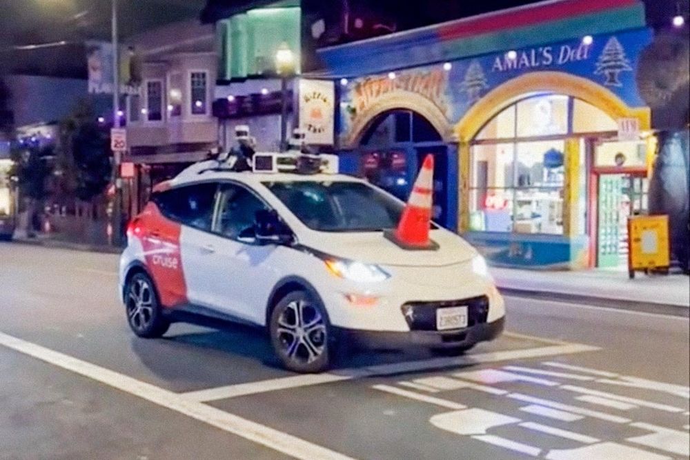 Cruise driverless vehicle stopped by putting a traffic cone on its hood.