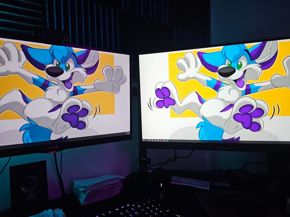 Old LG monitor on the left; new Asus ProArt monitor on the right