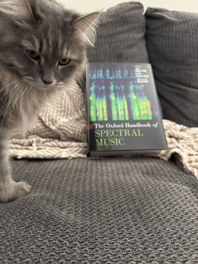 My boss Dorian poses in front of the Oxford Handbook of Spectral Music, in which my music makes an appearance in Yayoi Uno Everett’s article. A true honor. 