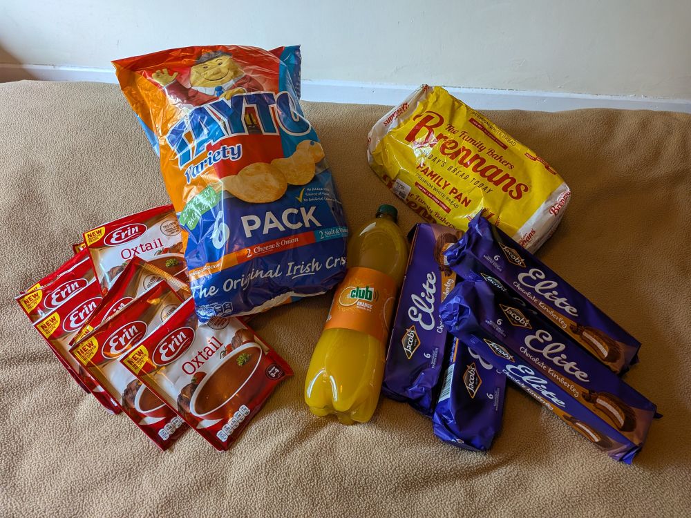 Tayto crisps, Erin oxtail soup, Club orange, Brennan's bread, and chocolate Kimberleys.
